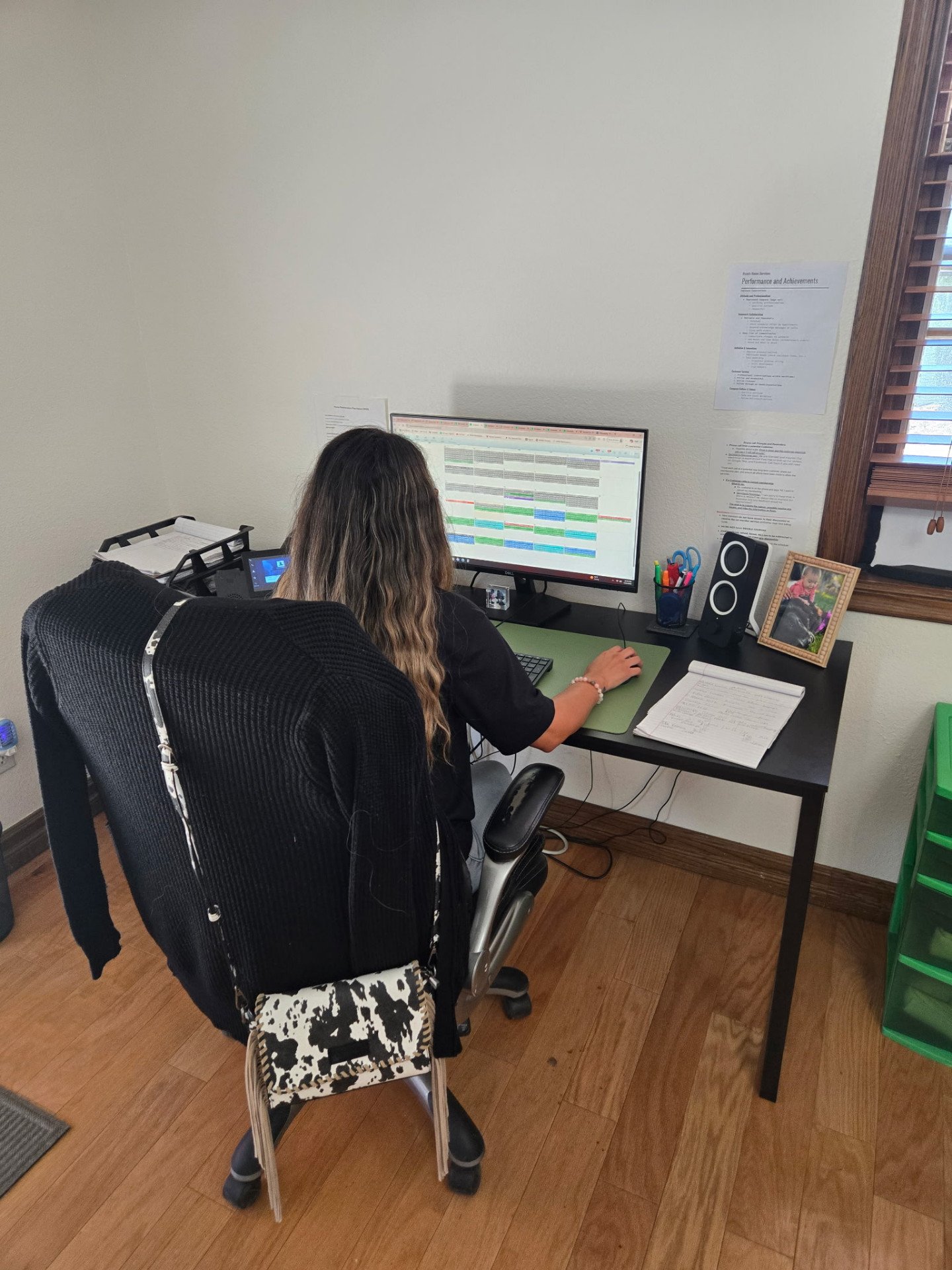 Inside the Ryan's Home Services office in Cherry Valley, CA — team member managing the daily schedule board